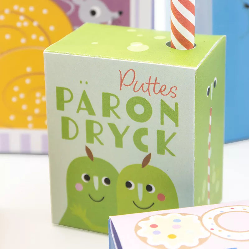 En liten päron-dricka, komplett med sugrör och roliga motiv runt om.