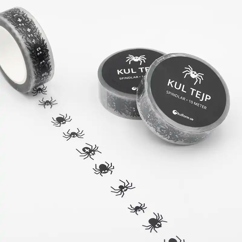 Spindlar på rad längs spindel-tejpen