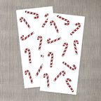 Två ark med polkagrisar att dekorera dina ljus med.