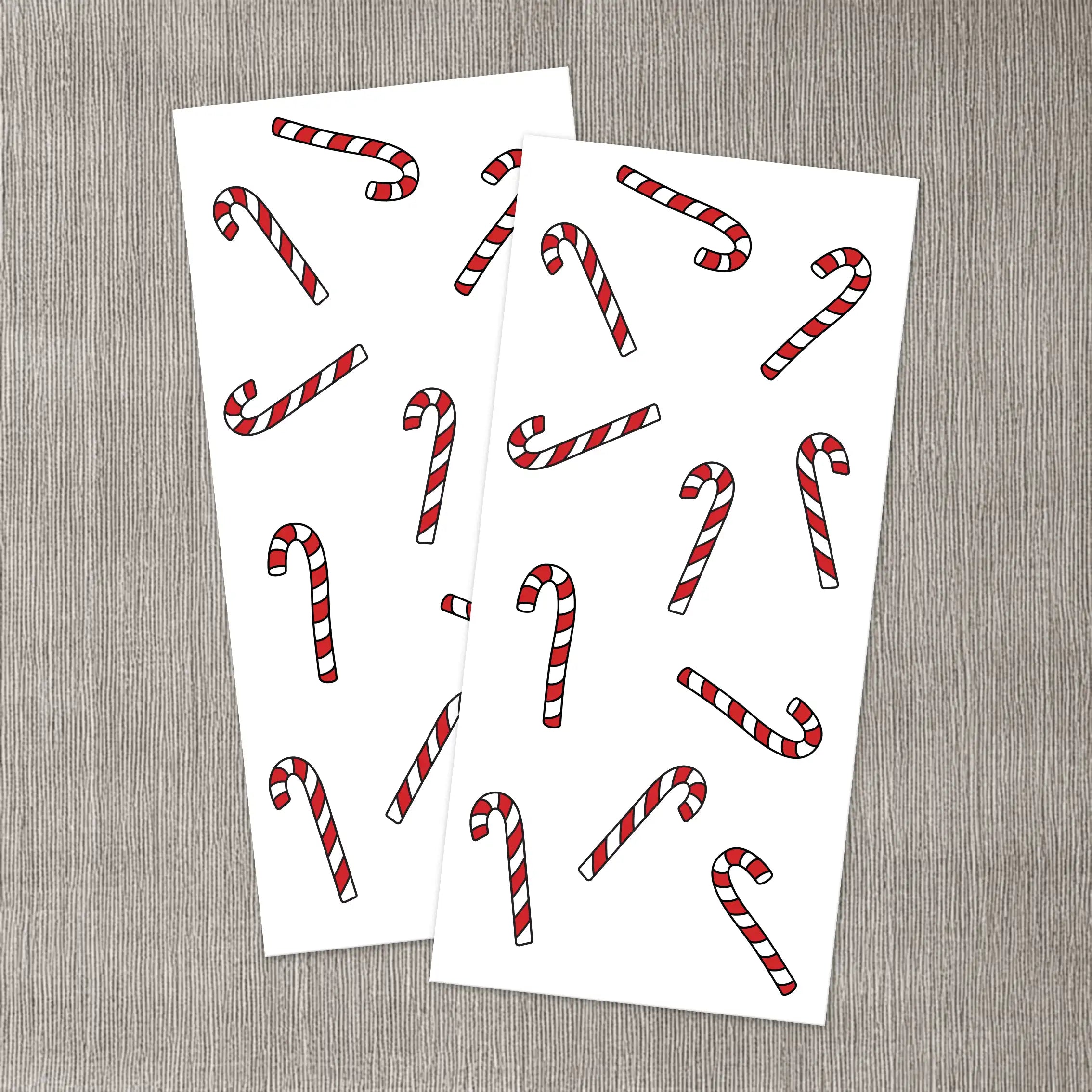 Två ark med polkagrisar att dekorera dina ljus med.