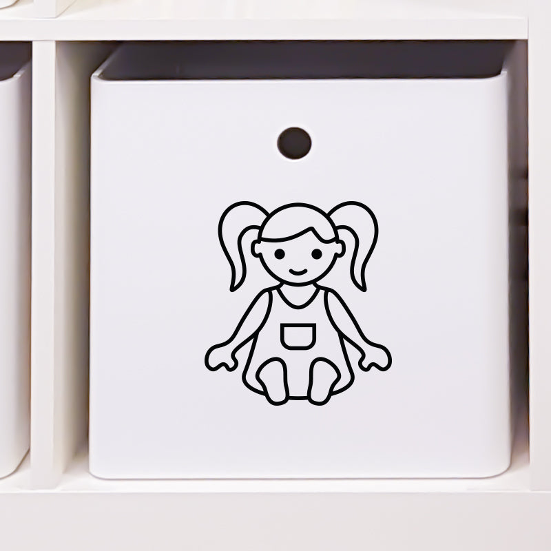 Leksakslåda märkt med symbol för dockor