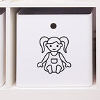 Leksakslåda märkt med symbol för dockor