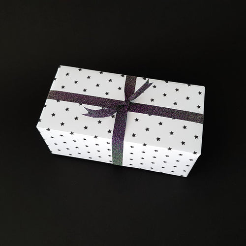 A beautifully wrapped gift with stars on the paper