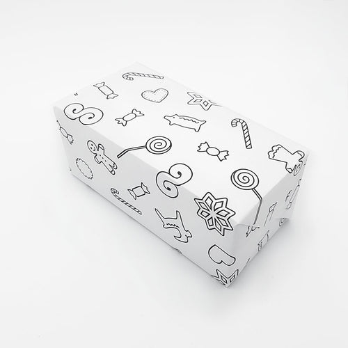 Gift in wrapping paper full of Christmas treats